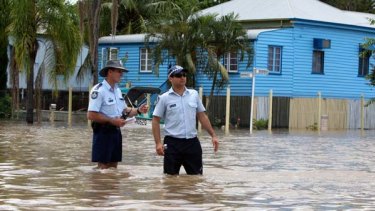 Police are on duty to protect homes emptied by evacuations from looters. The town could be cut off for 10 days.