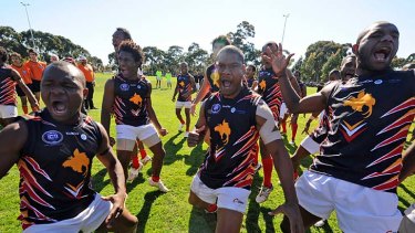 Battle dance: Papua New Guinea players issue the challenge before playing the US.