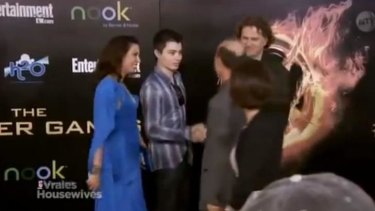 Elliot Rodger with his parents on the <i>Hunger Games</i> red carpet.