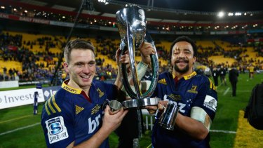 Winners are grinners: Ben Smith and Nasi Manu of the Highlanders hold up the trophy following the Super Rugby final  against the Hurricanes. 