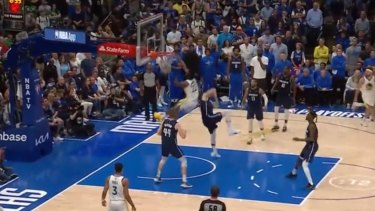 Andrew Wiggins dunks on Luka Doncic as the Warriors take game three.