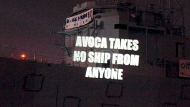 Projecting their anger ...  protesters make a point on the old warship.