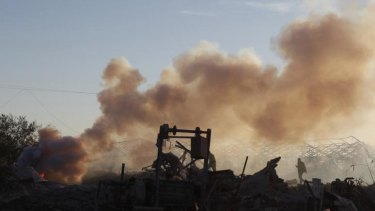 Israel responds ... A Palestinian inspects a Hamas training camp after it was hit by an Israeli air strike in Khan Younis in the southern Gaza Strip.