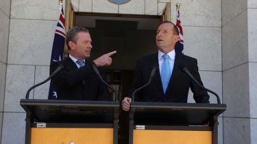 Education Minister Christopher Pyne and Prime Minister Tony Abbott address the media during a press conference at Parliament House.