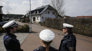 Police hold media away from the house where Andreas Lubitz lived in Montabaur, Germany.