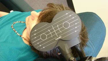 A patient being treated with transcranial magnetic stimulation.
