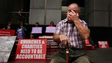 Les Johnson, 72, from Sydney, who grew up in orphanages in the Newcastle and Gosford area in the 1950s is pictured among protesters outside the Royal Commission.
