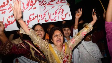 Supporters of former Mr Musharraf demonstrate in Lahore after the order for his arrest was announced.