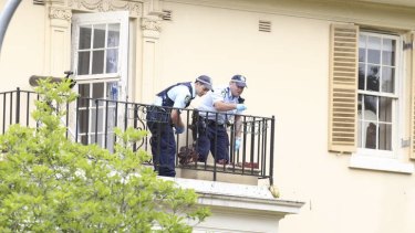 Police on the balcony of Jim Byrnes's Bellevue Hill home.