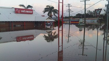 Flooding on Queen Street, Goodna, early this morning.
