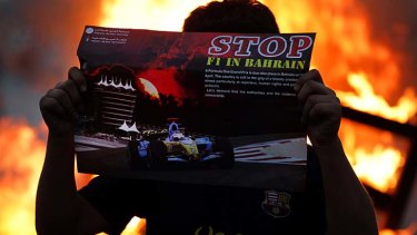 Sending a message: A protester shows his opposition to Sunday's Bahrain Grand Prix.