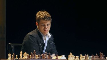 Master at work ... Competing at the 'Magnus Carlsen against the world' event in 2012.