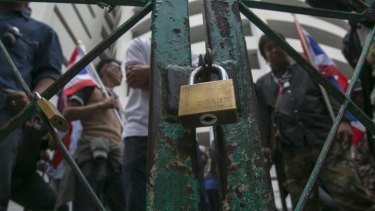 Protestors locked a gate at a polling station to block advanced voting for the February 2nd general elections.