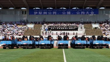 A public rally for the mass sentencing was held  at a sports stadium in Yining city.