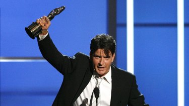 Better days: Actor Charlie Sheen accepts the award for outstanding actor in a television comedy for Two and a Half Men.