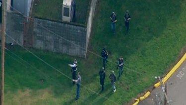 This KOMO news still shows emergency personnel responding after reports of a shooting at Marysville-Pilchuck High School in Marysville.