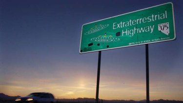 A car moves along the Extraterrestrial Highway near Rachel, Nevada. The CIA is acknowledging in the clearest terms yet the existence of Area 51, the top-secret Cold War test site that has been the subject of conspiracy theories for decades.