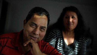 Victor Barrientos, with his wife Ana, is paid $21 an hour and works 11-hour days, six days a week.