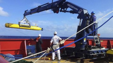 The Bluefin 21, the Artemis autonomous underwater vehicle, is hoisted back on board the Australian Defence Vessel Ocean Shield after a buoyancy test.