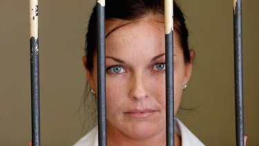 Could soon be on parole: Schapelle Corby stands behind the bars in the holding cell at Denpasar District Court in 2006 in Bali, Indonesia.