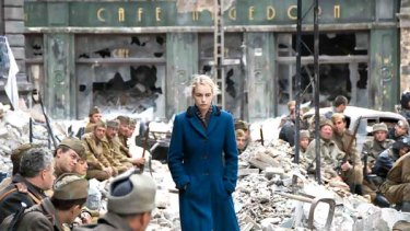 Actress Nina Hoss walks past a group of leering Soviet soldiers in the film A Woman in Berlin.