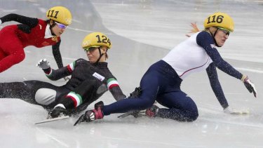In unison: China's Li Jianrou avoided incident to skate past Italy's Arianna Fontana (centre) and Britain's Elise Christie (right).