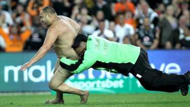 Crash tackled: the streaker at the Wests Tigers and Warriors qualifying final in 2011 at Allianz Stadium.