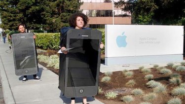 Greenpeace activists protest outside Apple's Cupertino headquarters.