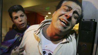 A distraught Dr Izz el-Deen Aboul Aish at  a Tel Aviv hospital after Israeli tank fire killed most of his family on Friday.