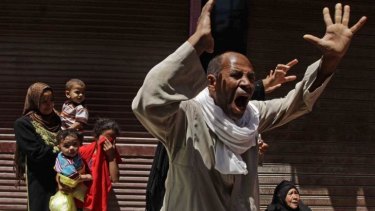 Relatives of a Muslim Brotherhood member sentence to death react outside the courtroom in Minya.
