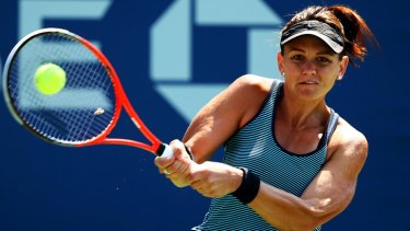 Casey Dellacqua returns a shot during her women's singles first round match against Ajla Tomljanovic of Croatia at the US Open.