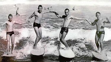 Brief encounters ... surfers show their style at Newcastle's Bar Beach in 1960.