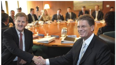 Peter Ryan and Ted Baillieu shake hands before their first cabinet meeting.