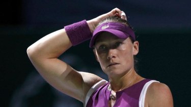 Samantha Stosur of Australia reacts during her WTA tennis championships match against Victoria Azarenka of Belarus.