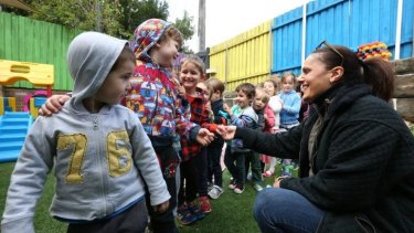 Teacher Diane Mirabito teaches manners to preschoolers at Rosebud Cottage, Rozelle.