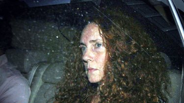 News International chief executive Rebekah Brooks leaves the office of The News of The World overnight.