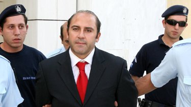 Athens police lead Mokbel into Greek's Supreme Court for an extradition hearing in October, 2007.