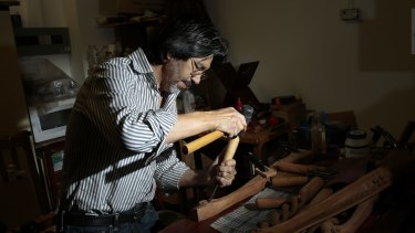 Afghan refugee and craftsman Hashmat Shafaq working on a table leg in his store Rosewood Furniture in Woden.  He was a woodworker in Afghanistan before he came to Australia in 1999.