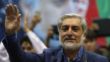Afghan presidential candidate Abdullah Abdullah waves to his supporters during a gathering in Kabul on Tuesday. 