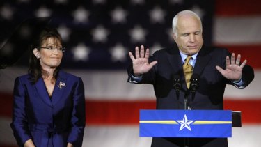 My turn to speak, not yours! ... Senator John McCain addresses the crowd on election night on November 4 last year as Sarah Palin looks on.