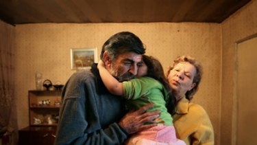 Multiple drug resistant TB sufferer Vazgen Hakobyan, 57, with wife Anahit and granddaughter Christine, at home in Yerevan, Armenia.