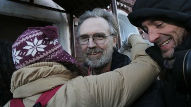 Colin Russell of Australia, one of the 30 people who were arrested over a Greenpeace protest at the Prirazlomnaya oil rig, is greeted as he is released on bail from prison in St. Petersburg.