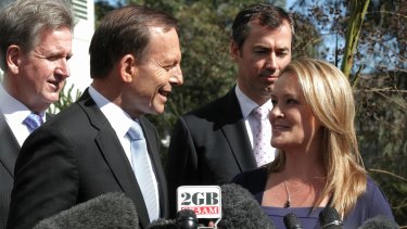 Happier times: Tony Abbott with Fiona Scott during the election campaign in 2013.