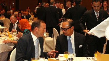 Prime Minister Tony Abbott meets with Indonesian businessman Suryo Sulisto during a business breakfast, in Jakarta on Tuesday.