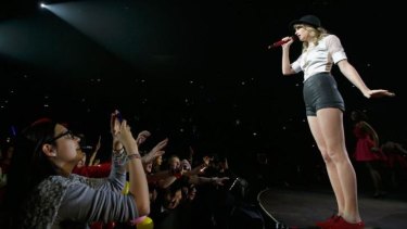 It's about public appeal, so how to get paid? Seven-time Grammy winner Taylor Swift on her <i>Red</i> tour in Europe.