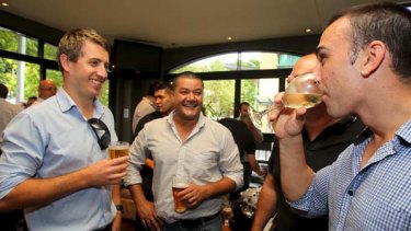 "I much prefer a glass of white or red" ... Sam Ciccia (right) eschews beer for a nice sauvignon blanc with his work colleagues.