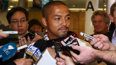 Shinji Ono speaks to the media after his arrival in Sydney.
