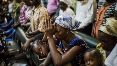 Residents of the West Point neighbourhood attend church after a 10-day quarantine was lifted in Monrovia, Liberia last month.