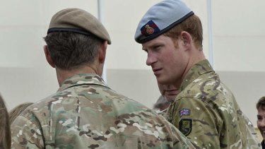 Prince Harry toured the base where he met past and present members of the unit and honoured fallen members at the Garden of Reflection.