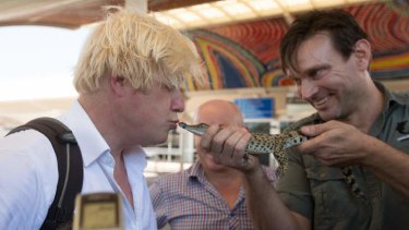 Lord mayor of London Boris Johnson meets George the royal crocodile at Darwin International Airport.